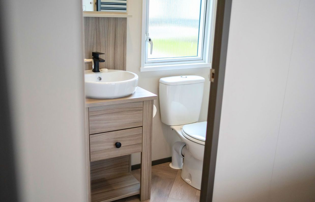 Internal of a caravan bathroom with toilet and sink