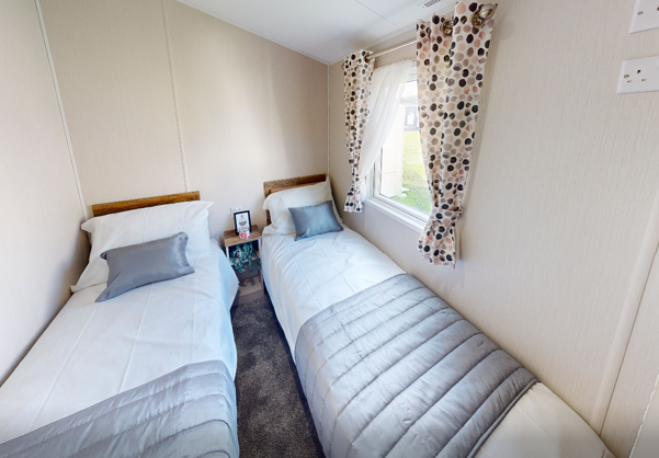 Internal of a caravan twin bedroom