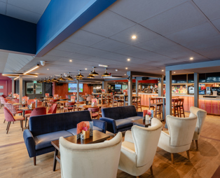 Internal of the Arena Sports Bar indoor seating arrangement with sofas
