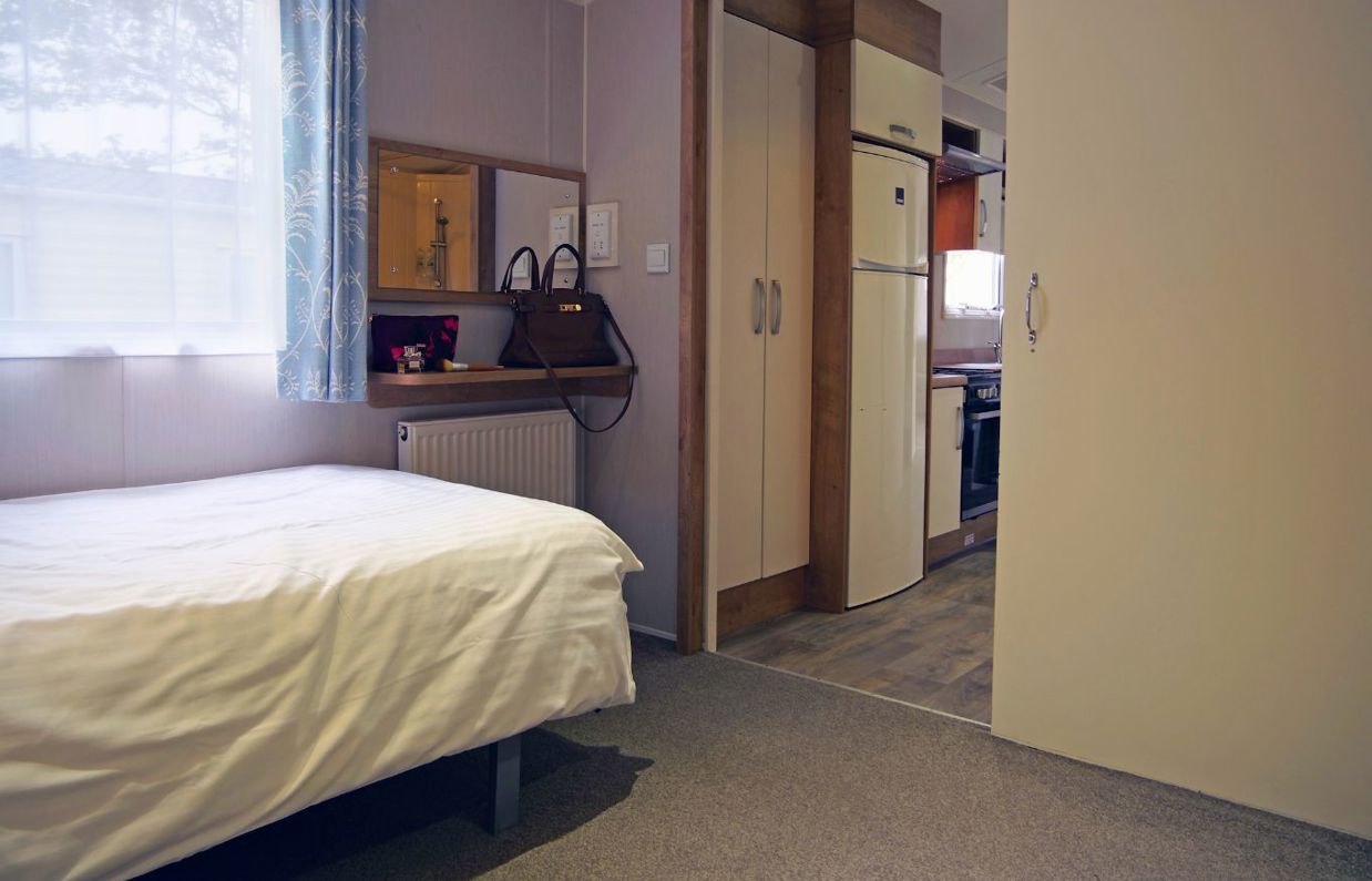 Internal of an accessible caravan spacious twin bedroom