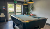 Pool table in games area of Family Room at Stargazy Bar & Grill