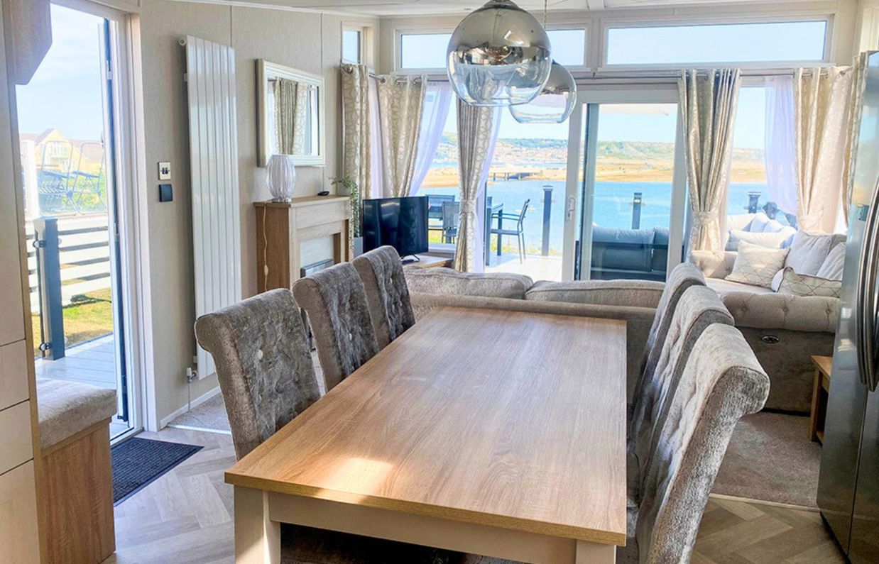 Internal of a caravan open plan living space with seaviews