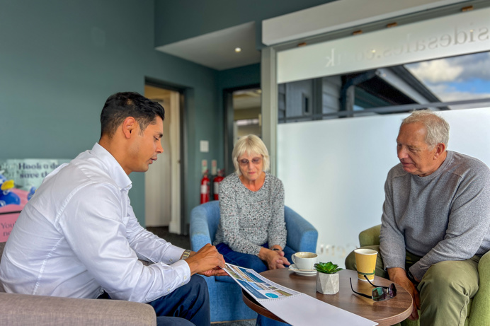 Couple talking with Sales Team Member on an Experience Day