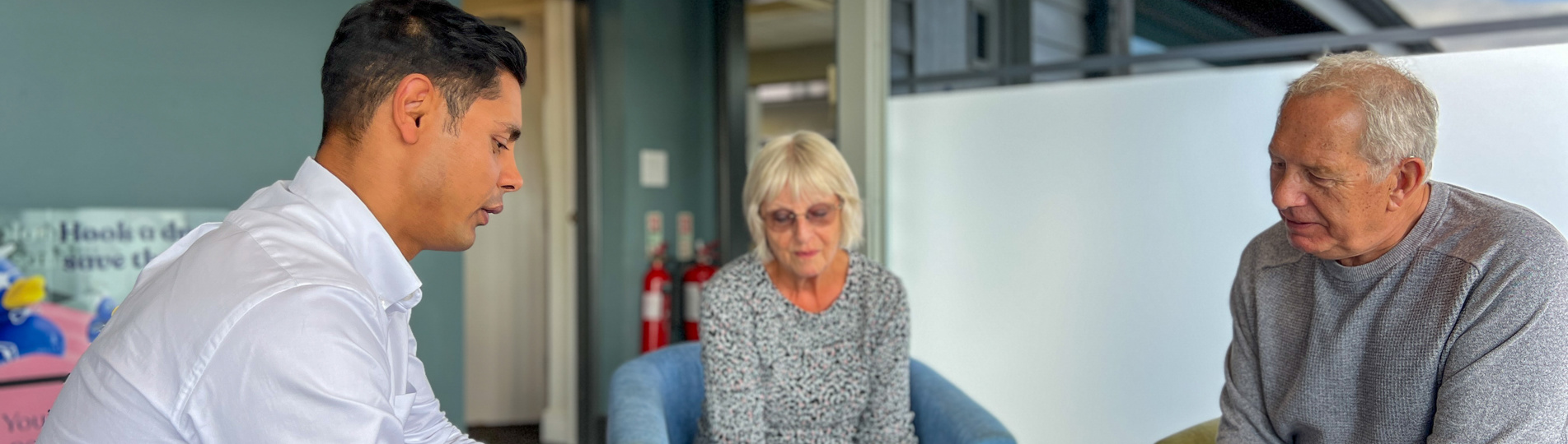 Couple talking with Sales Team Member on an Experience Day