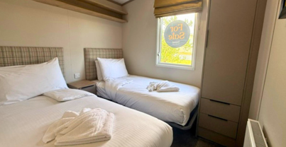 Internal of a caravan twin bedroom