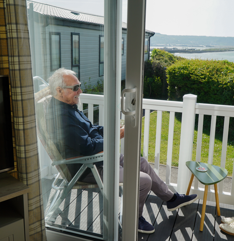 Chesil Beach Owners sitting on deck