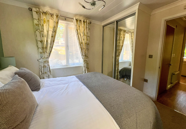Internal of a lodge master bedroom with storage