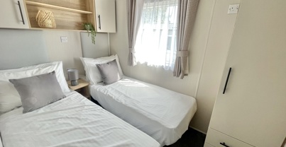 Internal of a caravan twin bedroom