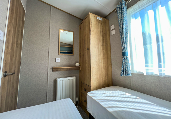 Internal of a caravan twin bedroom