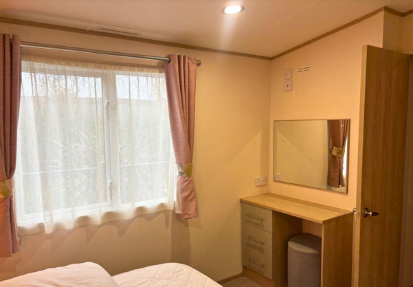 Internal of a caravan master bedroom dressing area