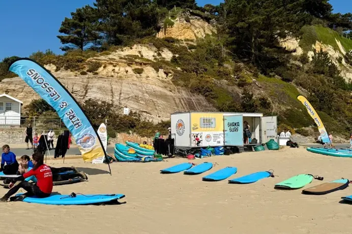 A range of surf boards set up on the beach