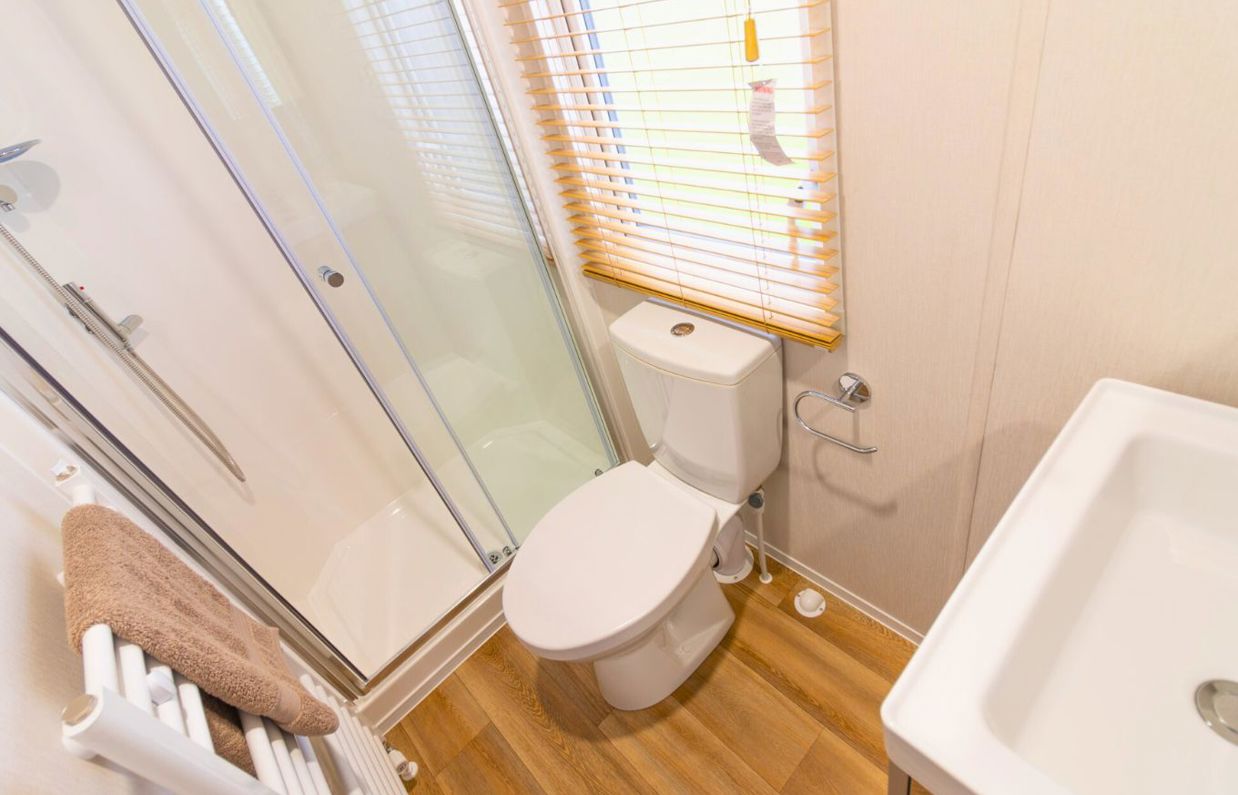 Internal of a caravan bathroom with shower toilet and sink