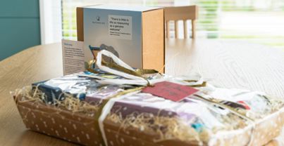 Internal of a luxury lodge dining table with welcome gifts