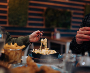 A cheese pull of Mac 'n' Cheese from Southside Bar & Grill 