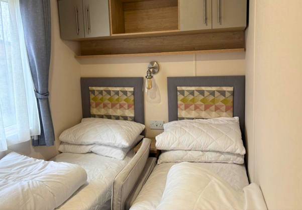 Internal of a caravan twin bedroom