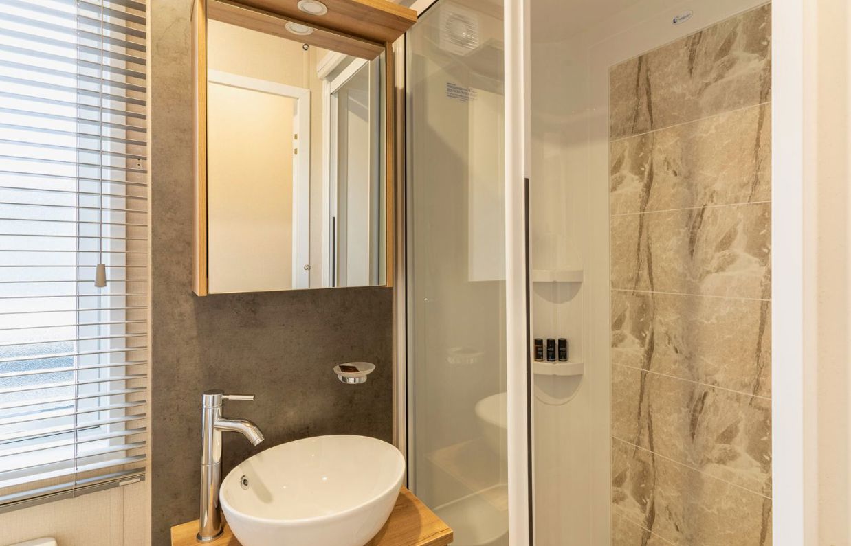 Internal of a caravan bathroom with shower and sink