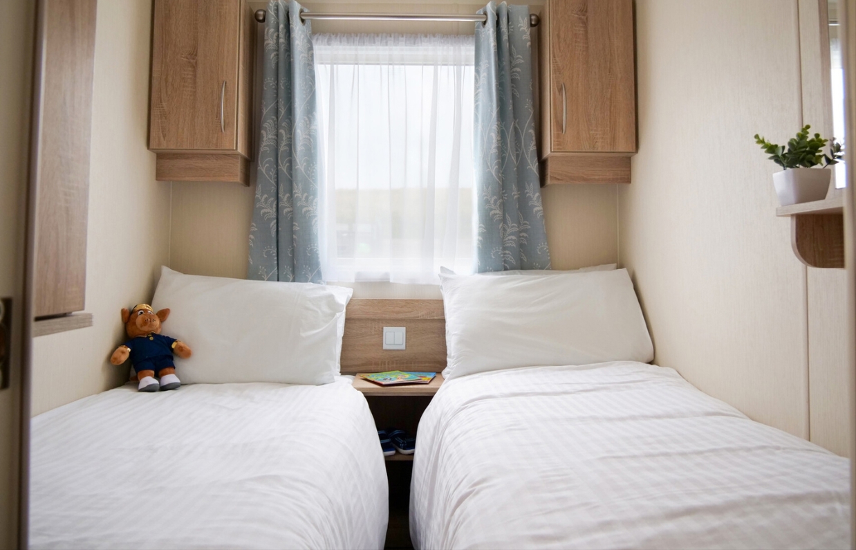 Internal of a caravan twin bedroom