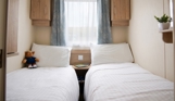 Internal of a caravan twin bedroom