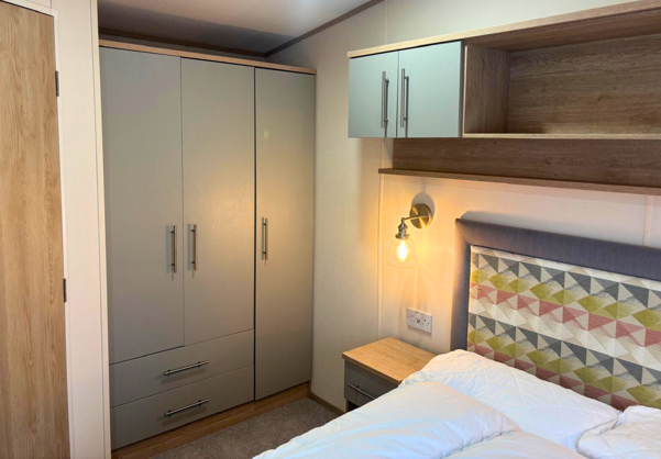 Internal of a caravan master bedroom storage area