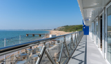 Sea, beach and Weymouth Bay views from Drift Bar & Grill balcony on a sunny, blue sky day