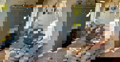 Large electric wood-burner style fireplace in lounge