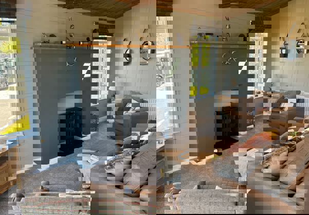 Large electric wood-burner style fireplace in lounge