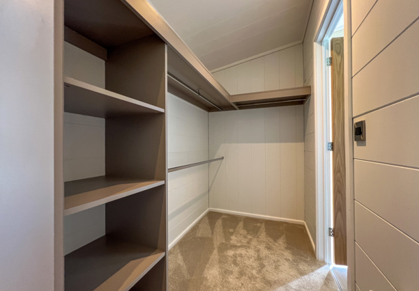 Internal of a luxury lodge master bedroom walkthrough wardrobe