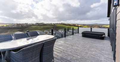Valley view from decking with outdoor seating and hot tub