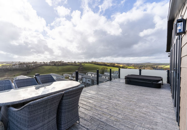 Valley view from decking with outdoor seating and hot tub