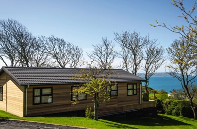 A lodge on pitch at a lodge park with views of the sea