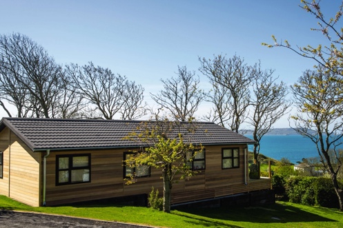 A lodge on pitch at a lodge park with views of the sea