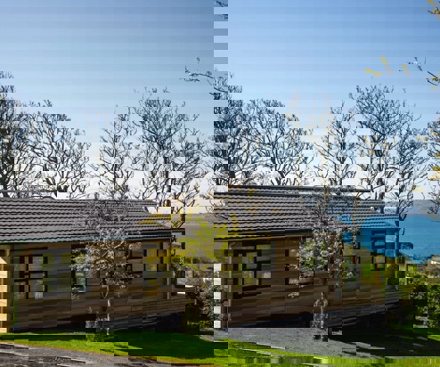 A lodge on pitch at a lodge park with views of the sea