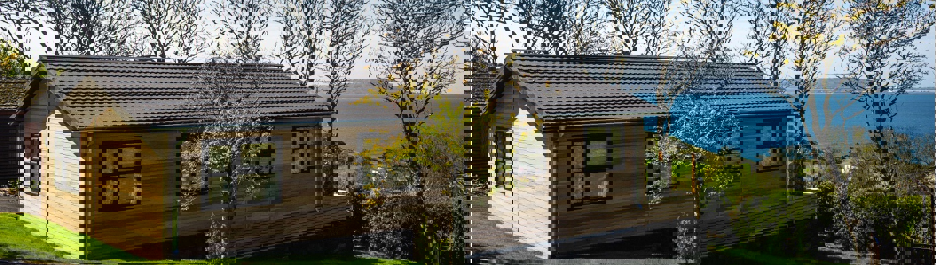 A lodge on pitch at a lodge park with views of the sea