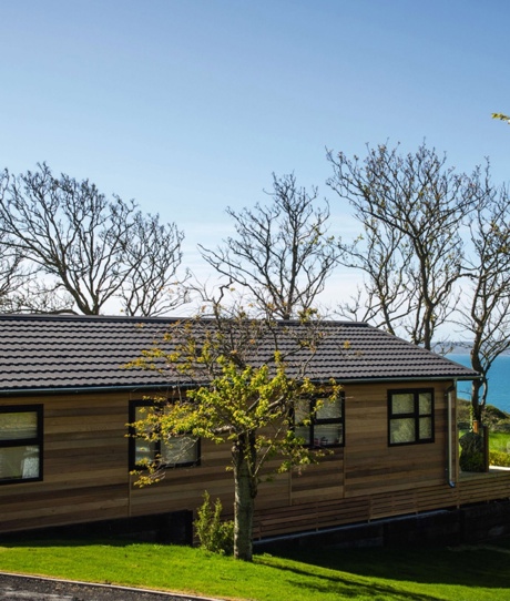 A lodge on pitch at a lodge park with views of the sea
