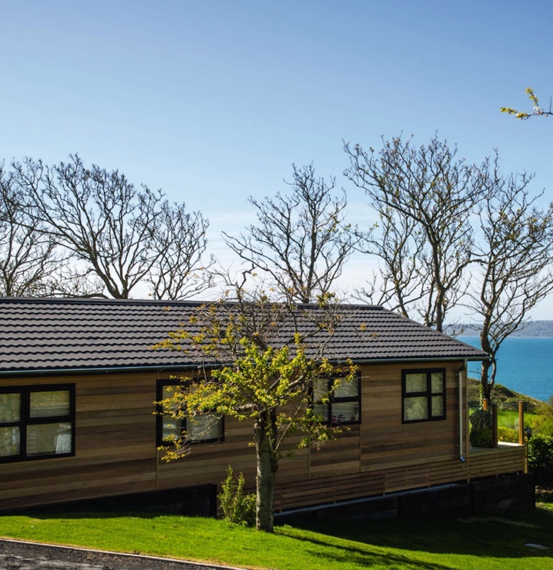 A lodge on pitch at a lodge park with views of the sea