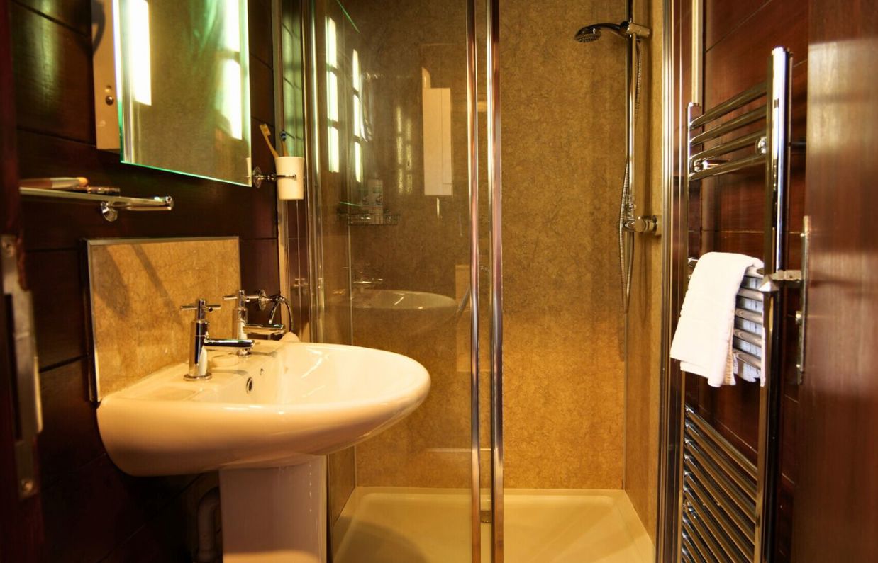 Internal of safari tent bathroom with sink and shower