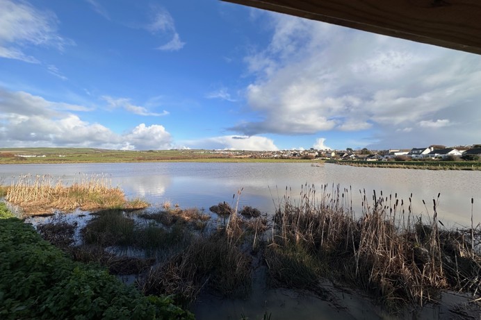 View of Maer Lake from a viewing point on a blue sky day