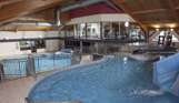 A heated indoor pool leisure complex with multiple areas, slides, jacuzzi and gym