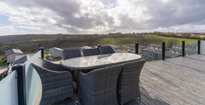 Outdoor seating area on holiday lodge decking