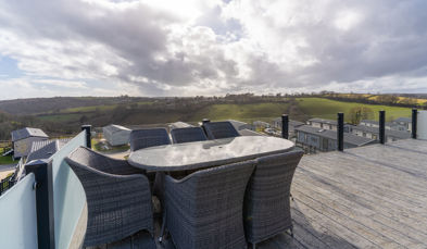 Outdoor seating area on holiday lodge decking