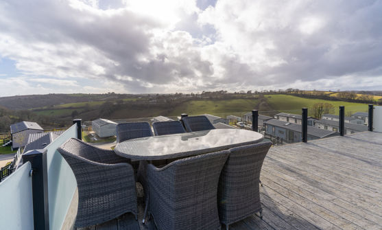 Outdoor seating area on holiday lodge decking