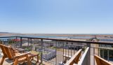 Views of Chesil Beach and the Jurassic Coast from the balcony of Chesil Beach apartments with outdoor furniture