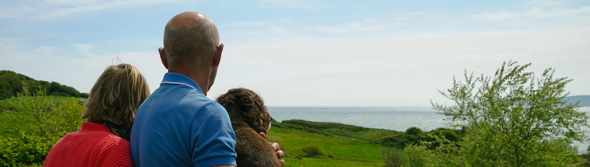 Osmington Owners enjoying view from deck with dog