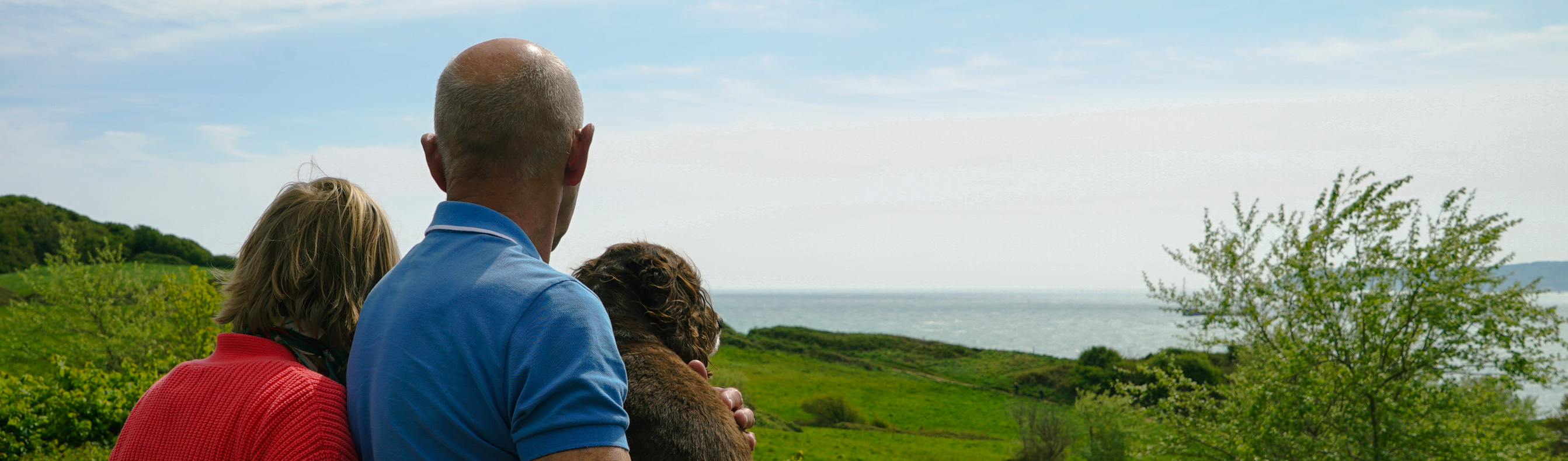 Osmington Owners enjoying view from deck with dog