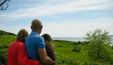 Osmington Owners enjoying view from deck with dog