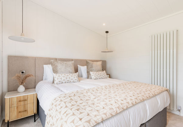 Internal of a luxury lodge master bedroom with king size bed