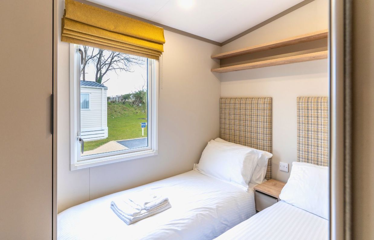 Internal of a caravan twin bedroom