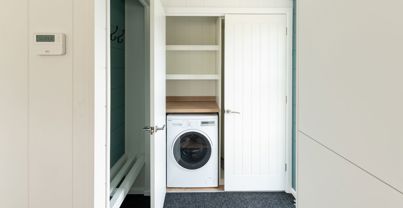 Internal of a luxury lodge hallways with washing machine