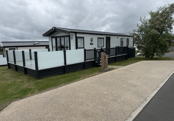 External of a caravan on pitch with decking