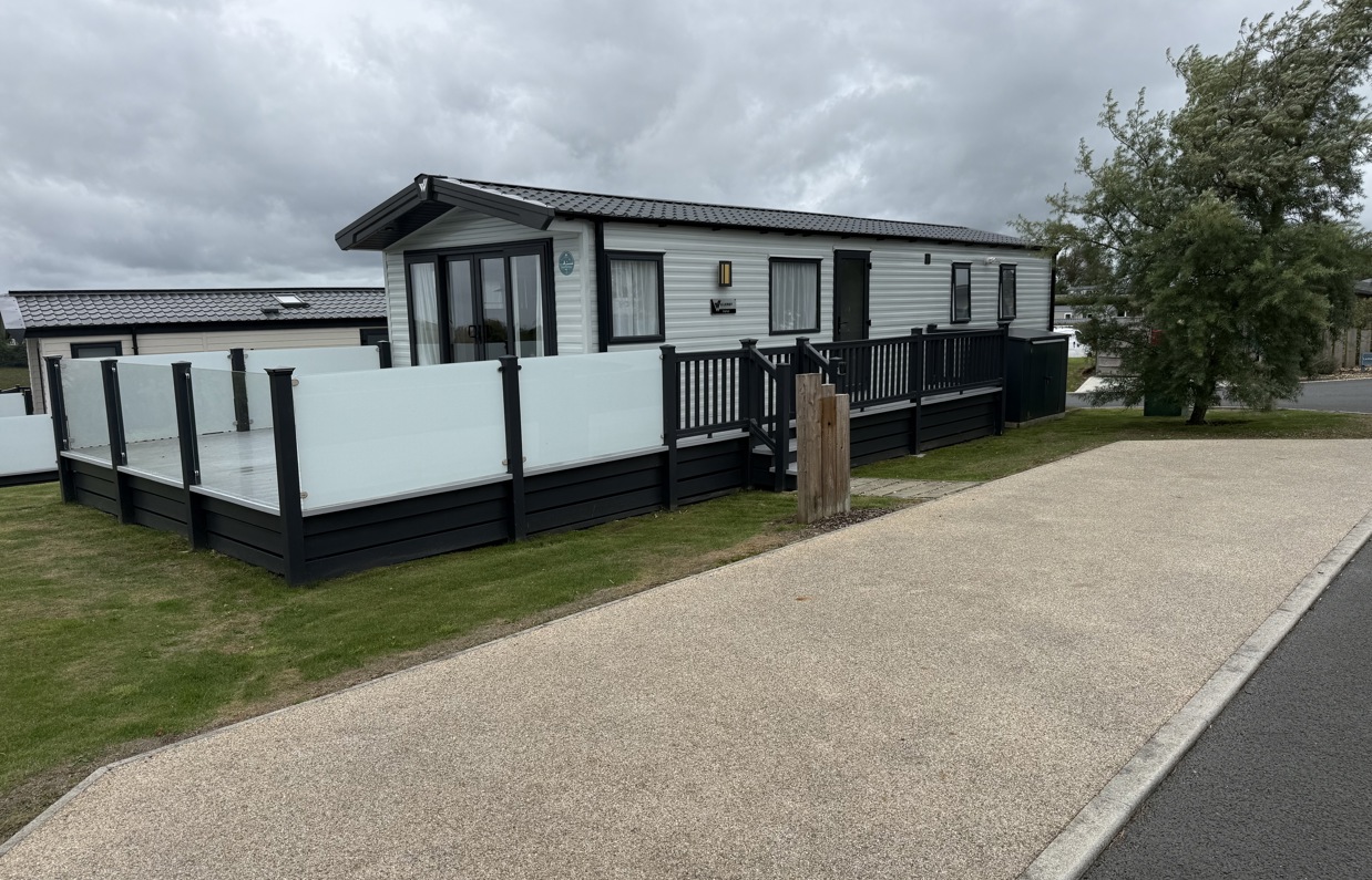 External of a caravan on pitch with decking